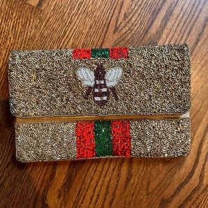 Gold beaded bee clutch